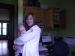 April Mackinnon with her baby Andrew in her home busniess, Anointment
